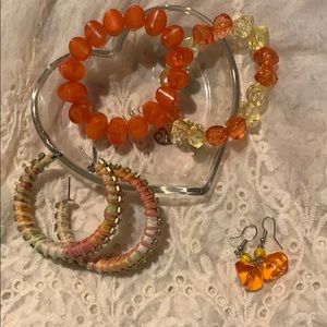 Orange costume bracelets & 2 or earrings